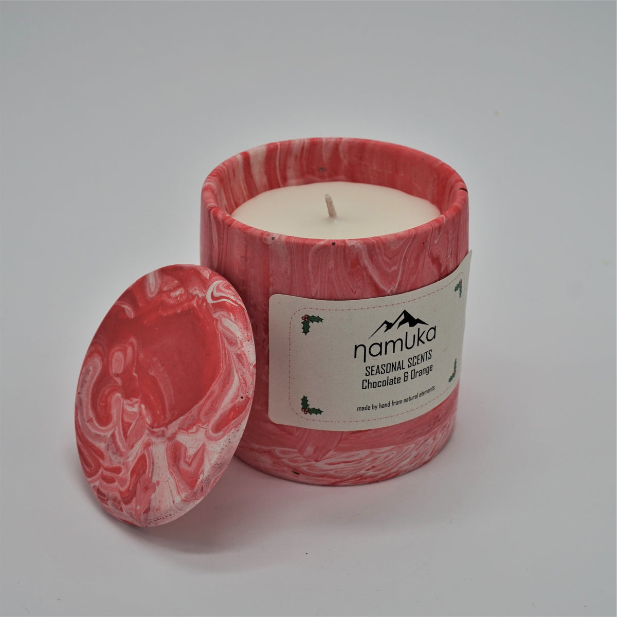 chocolate and orange scented candle in a pink marbleized handpoured composite container. vegan friendly using rapeseed wax and essential oils. 
